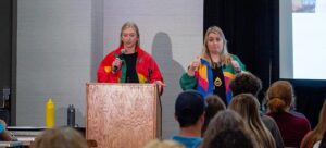 2023 best of conference winners wore colorful track suits during their session