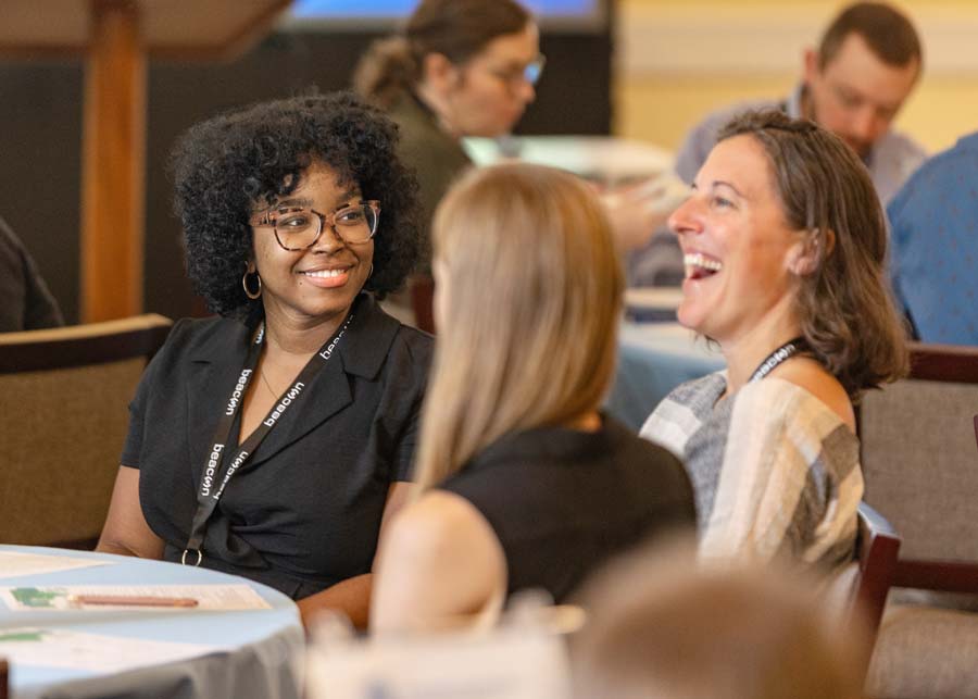 Attendees connecting at a regional conference