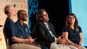 Leaders on stage during the 2025 Collegium Chat